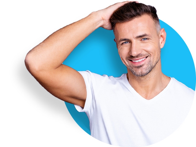 a man running his hand through his thick hair